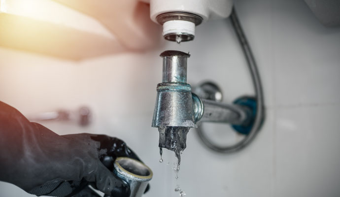 Fixing a leaky and clogged sink pipe drain