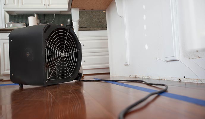Water damaged floor drying with equipment