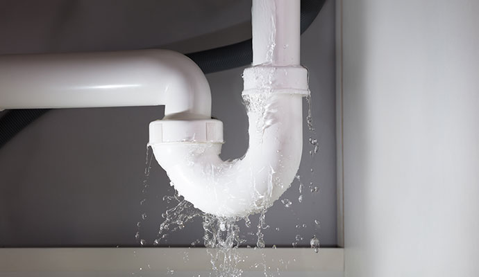 Water leaking from plumbing pipe